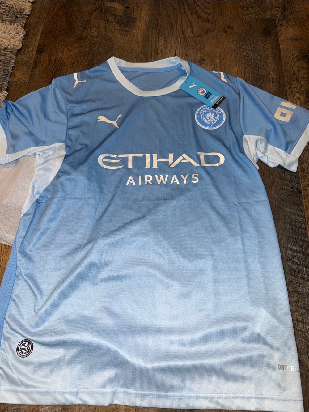 Puma Men’s Light Blue Manchester City Jersey with Etihad Logo Size Large